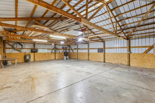 Pole barn interior with wood burning stove