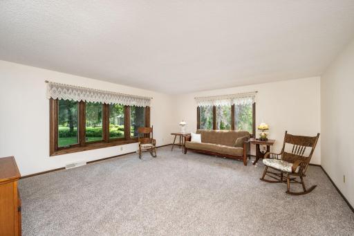 Large living room with bow window and new carpet