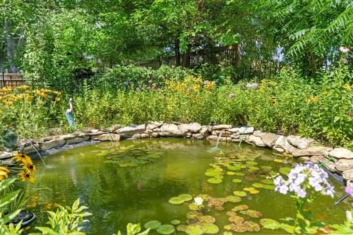 Stone surrounded pond with tranquil water features will take your days stress away