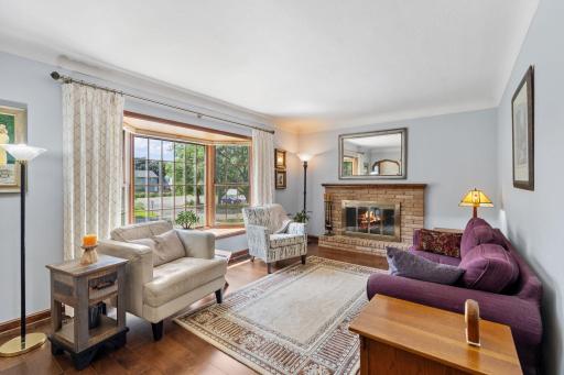 Impressive living room with wonderful west facing bay window offers light bright spaces
