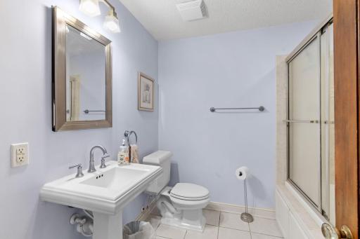 Lovely updated bath with attractive tiles & pedestal sink