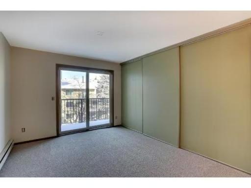 Bedroom with patio and large closet