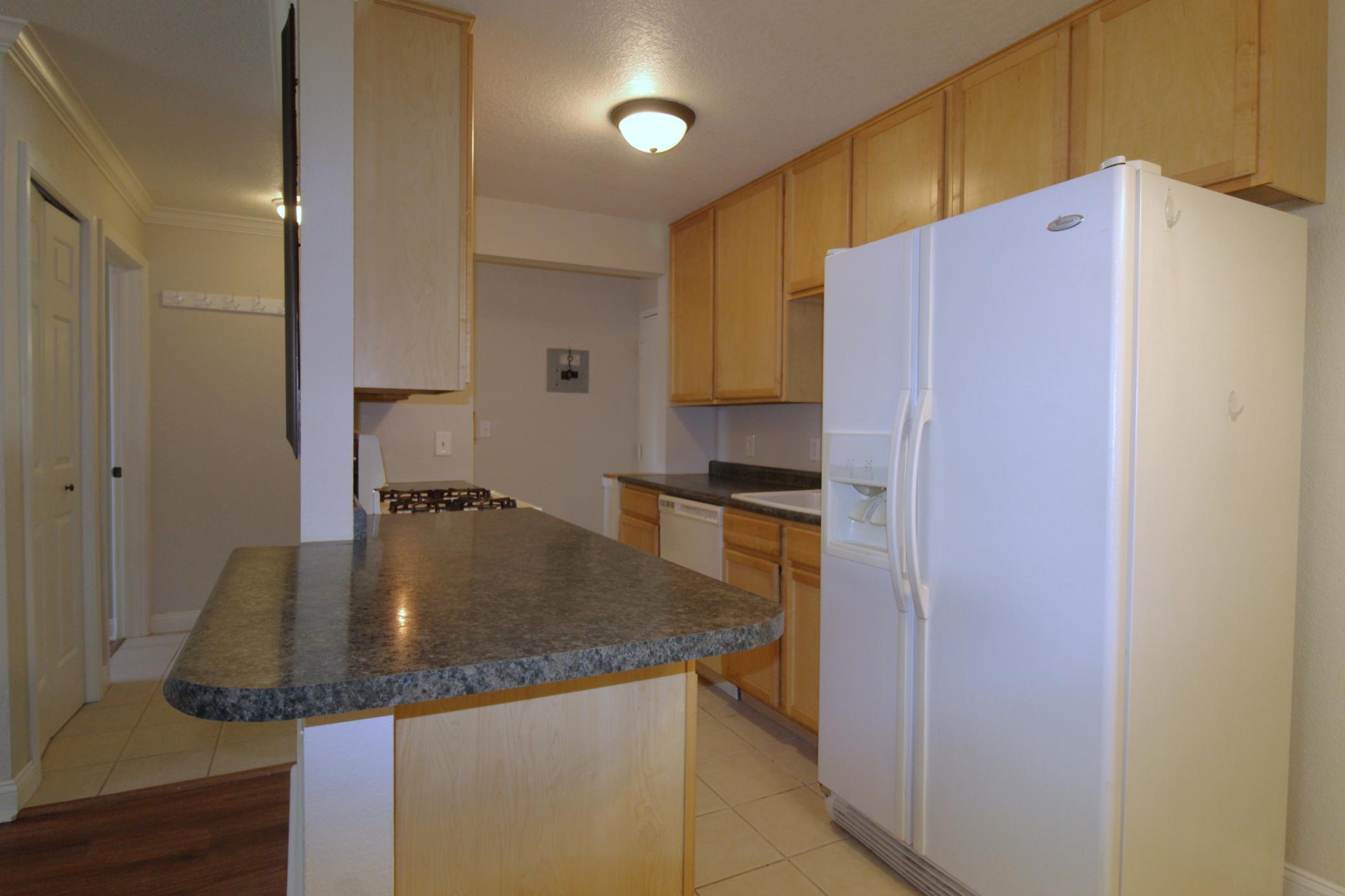Kitchen with breakfast bar and maple cabinets