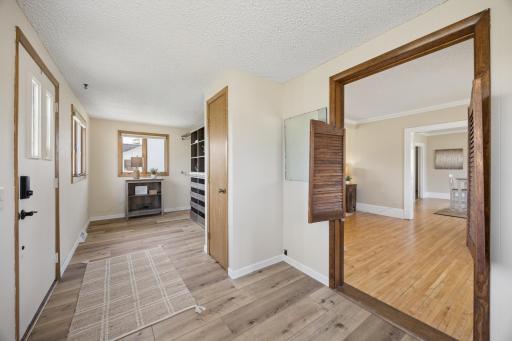 Spacious porch/foyer has been converted to a walk in closet