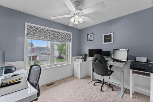 One bedroom showcases classic wainscoting for added character.