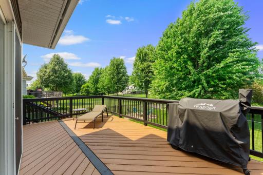 Out back, the stained cedar deck overlooks the fully fenced yard.