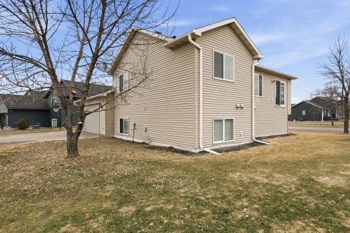 Large sideyard with alley access to garage