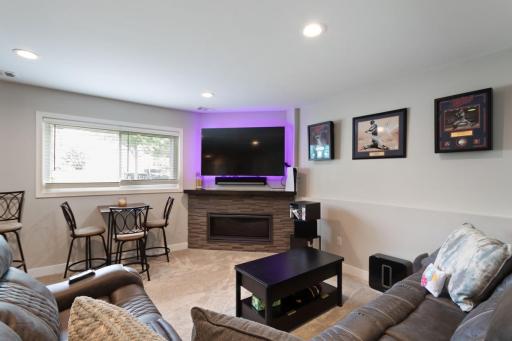 The family room includes a decorative ledge and space for a bistro table, creating a flexible layout that's perfect for entertaining, or gathering with friends and family.