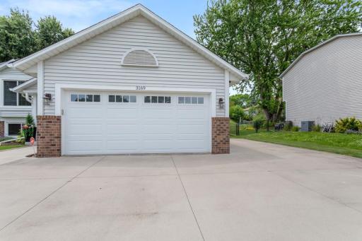 New concrete driveway (2018) with extra parking. Finished, insulated garage (2026) with new overhead & entry doors (2019). A storage shed with lighting provides convenient extra storage beside the garage. The fence has a double gate for easy access.