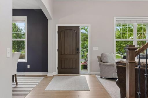 Front door opens to formal living and dining spaces