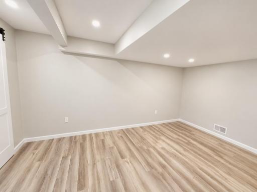 Basement family room with recessed lighting