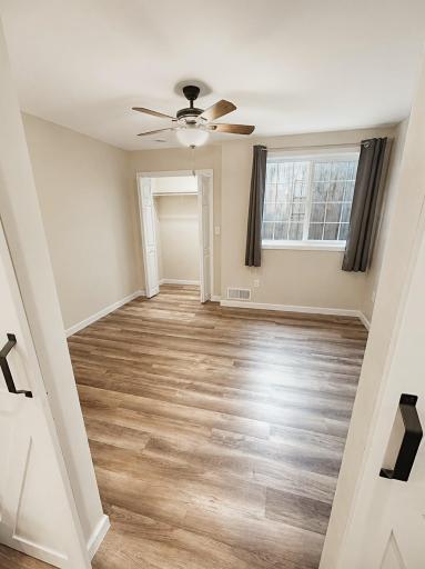 Bedroom 4 downstairs with barn doors, large closet and large egress window