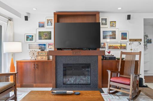 Thoughtfully placed can lighting highlights the lovely built-ins.