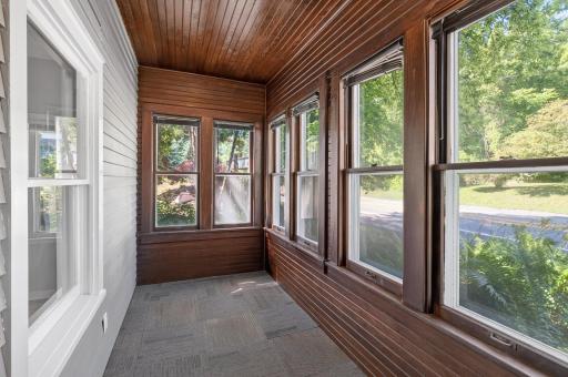The front porch on the west is a heated and cooled space, comfortable in all seasons.