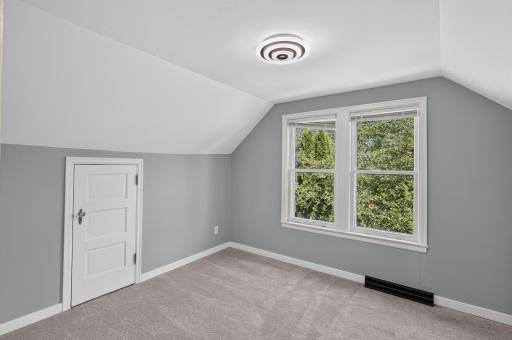 Note the extra knee-wall storage in this bedroom.