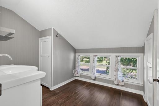 The spacious bathroom has two linen closets. These dormer windows face west.