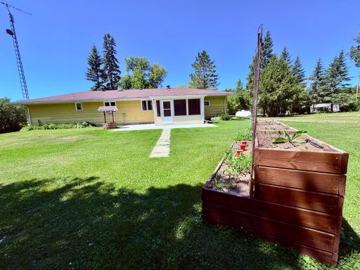Big back yard with raised garden area