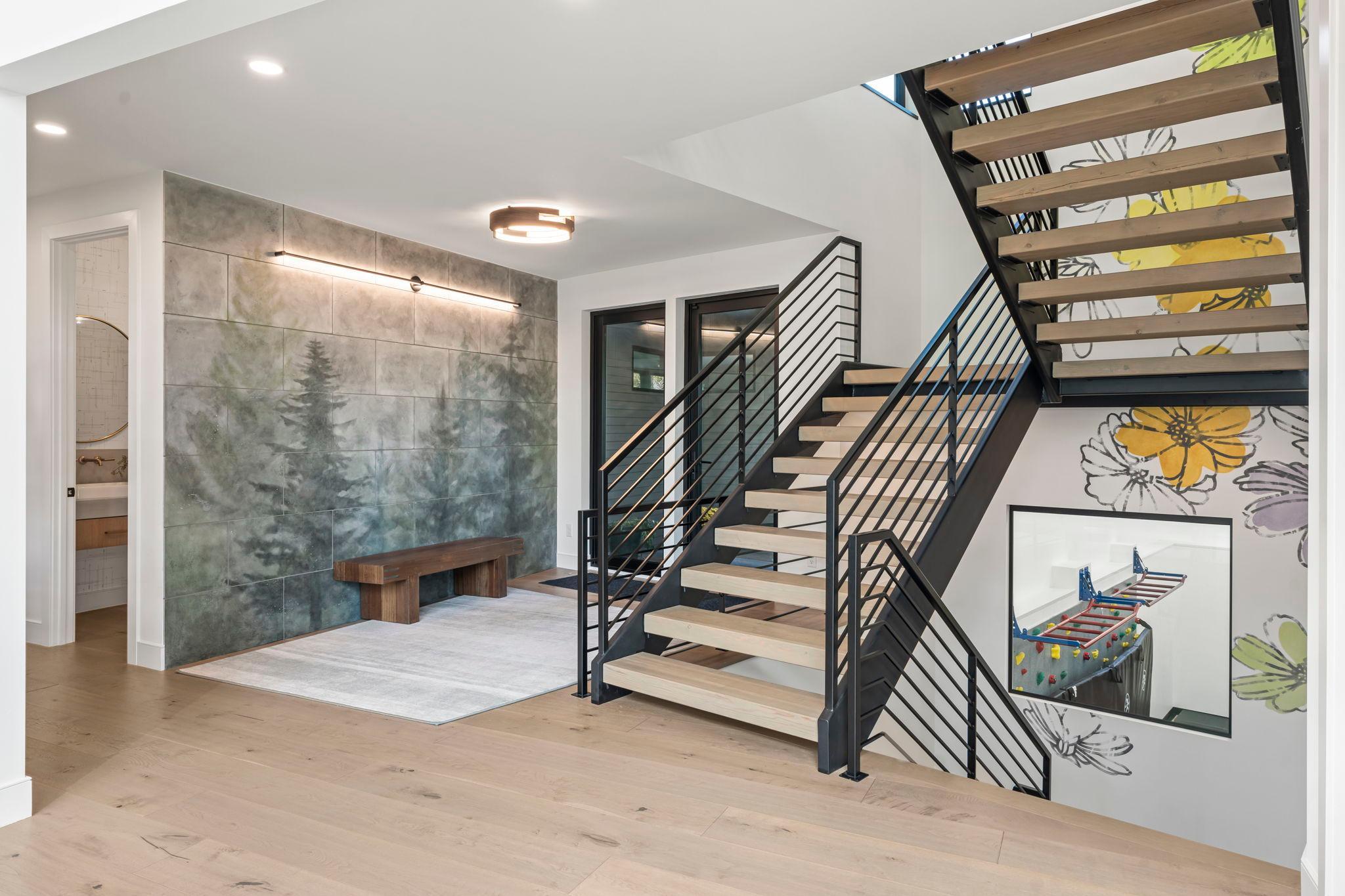 The custom built open staircase is a must see
