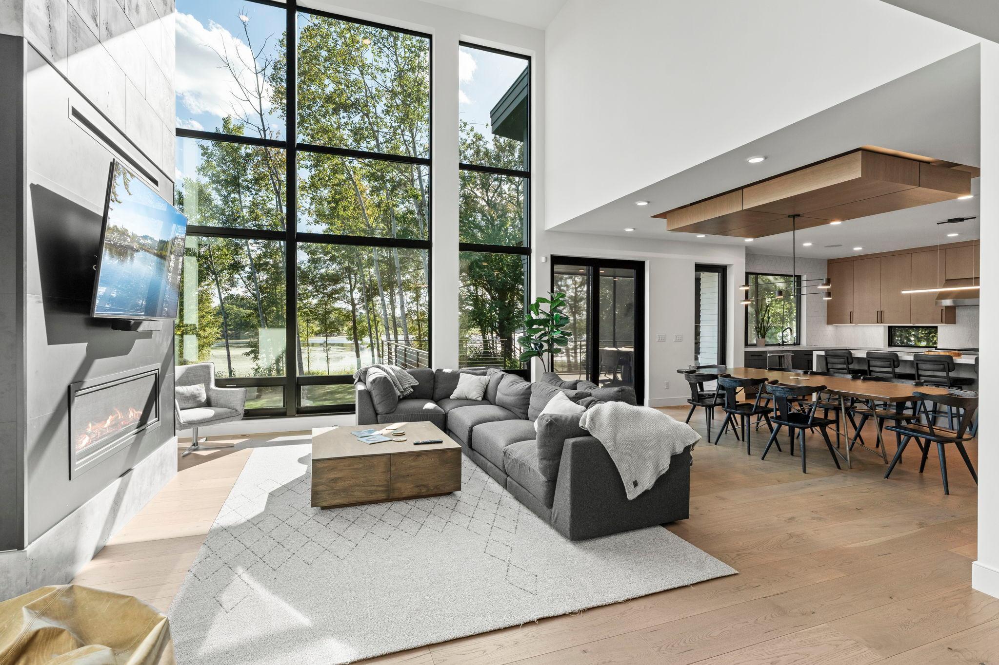 Wall of glass windows offer spectacular, panoramic lake views and the calming presence of nature.