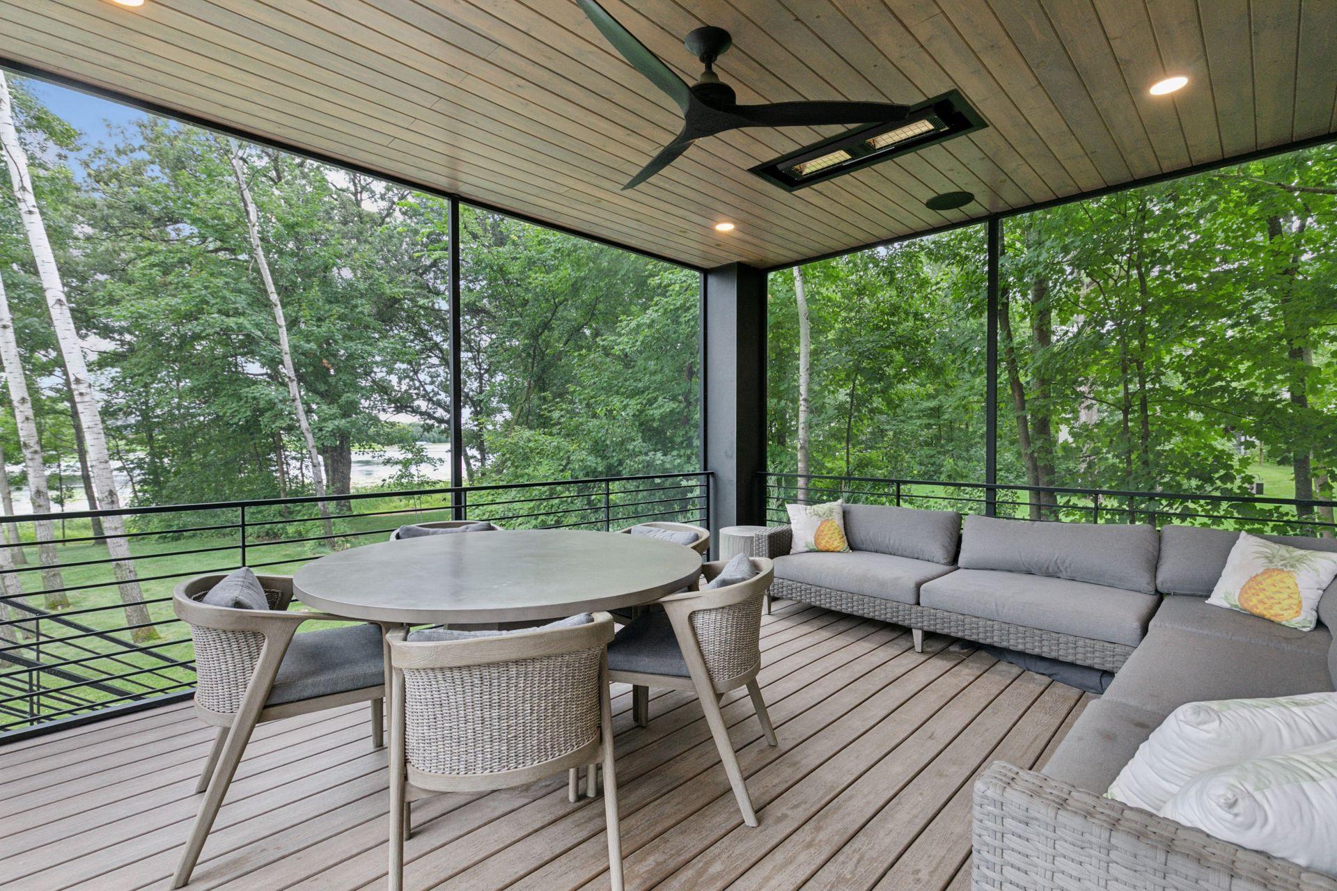 Serene screened porch with wooded tree and lake views!