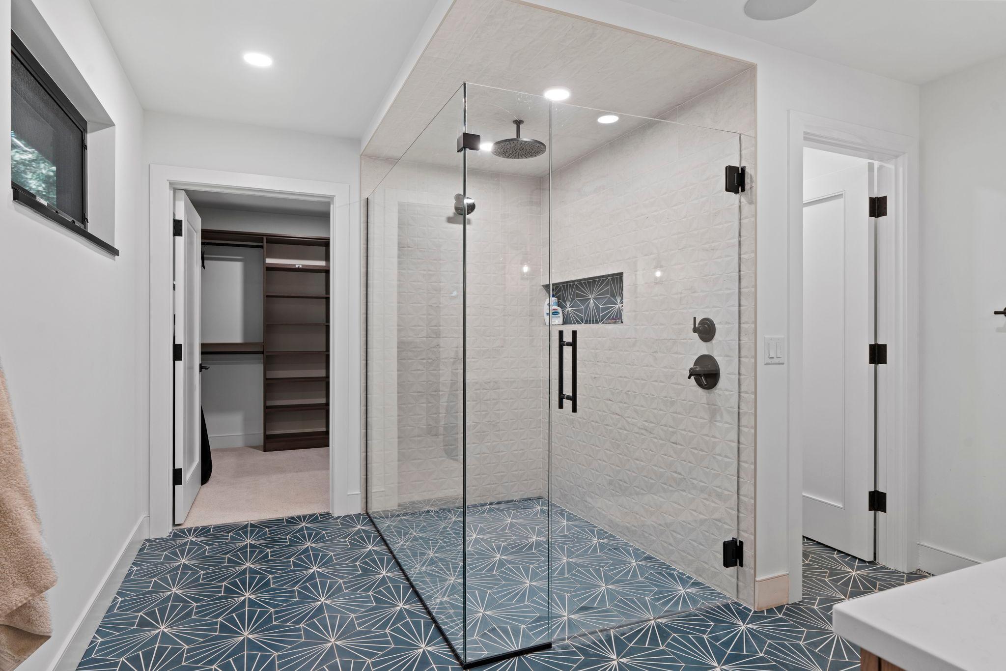 Gorgeous, primary walk-in shower.