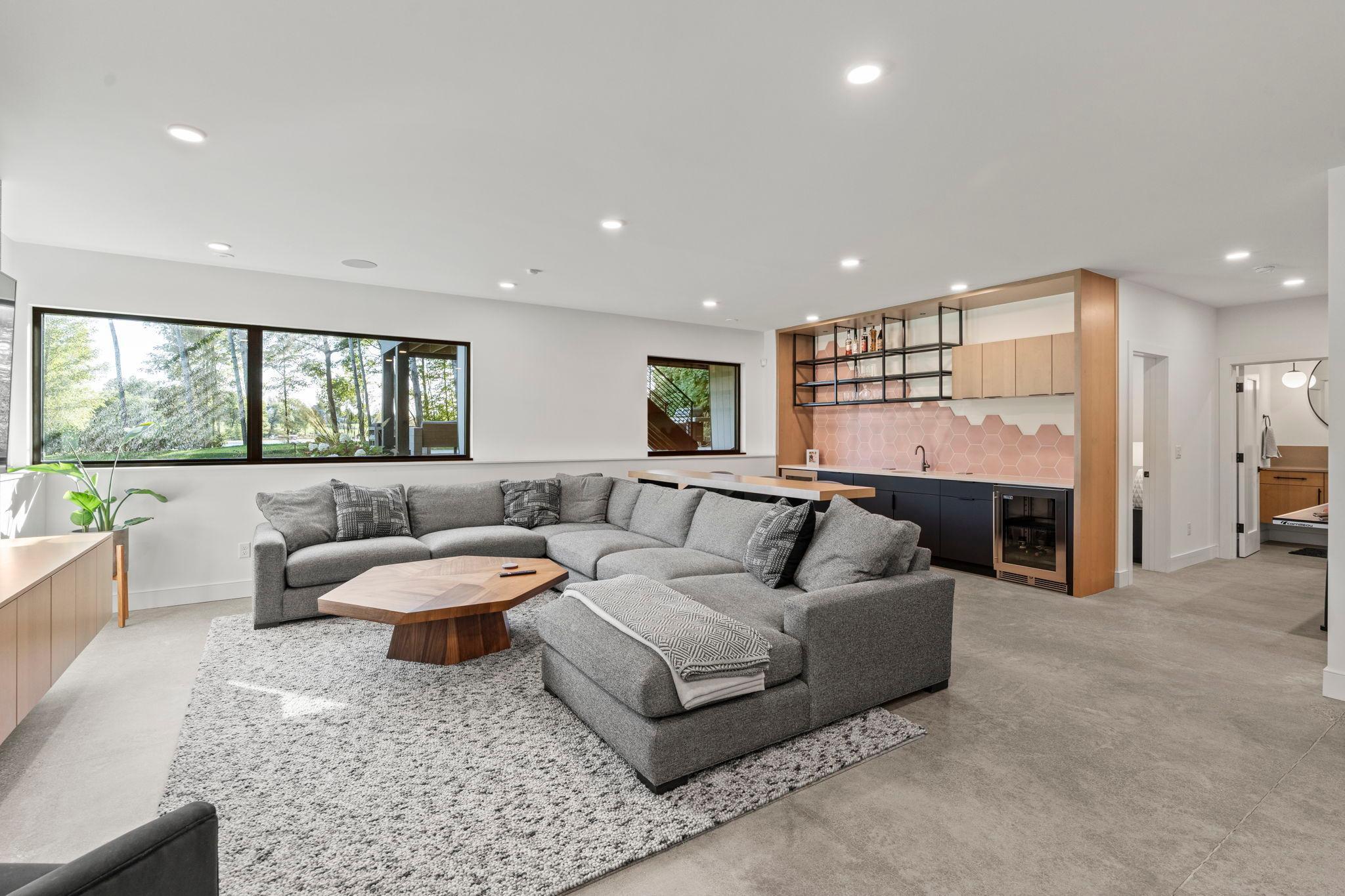 Amazing lower level family room with lookout windows