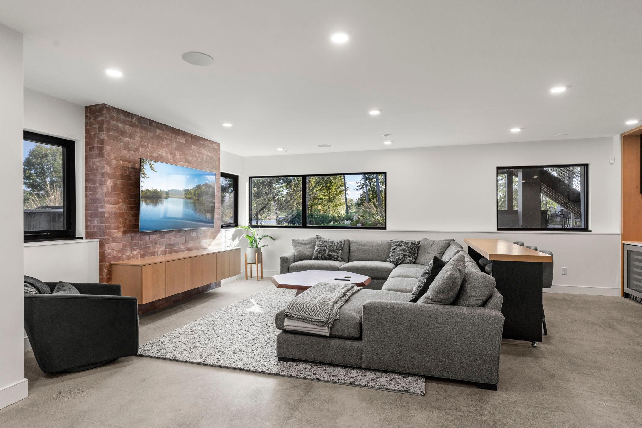 Family room with a view. Large lookout windows accent the