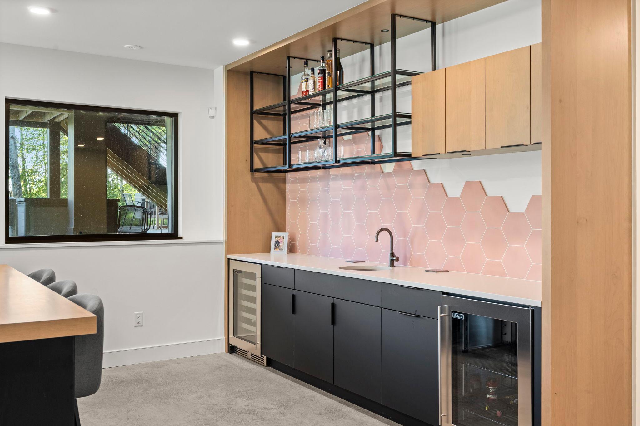 This walk-up bar offers a a beautifully patterned honeycomb backsplash adds geometric charm and artistic flair, blending modern style with clean lines and natural symmetry bring texture and interest to the space.