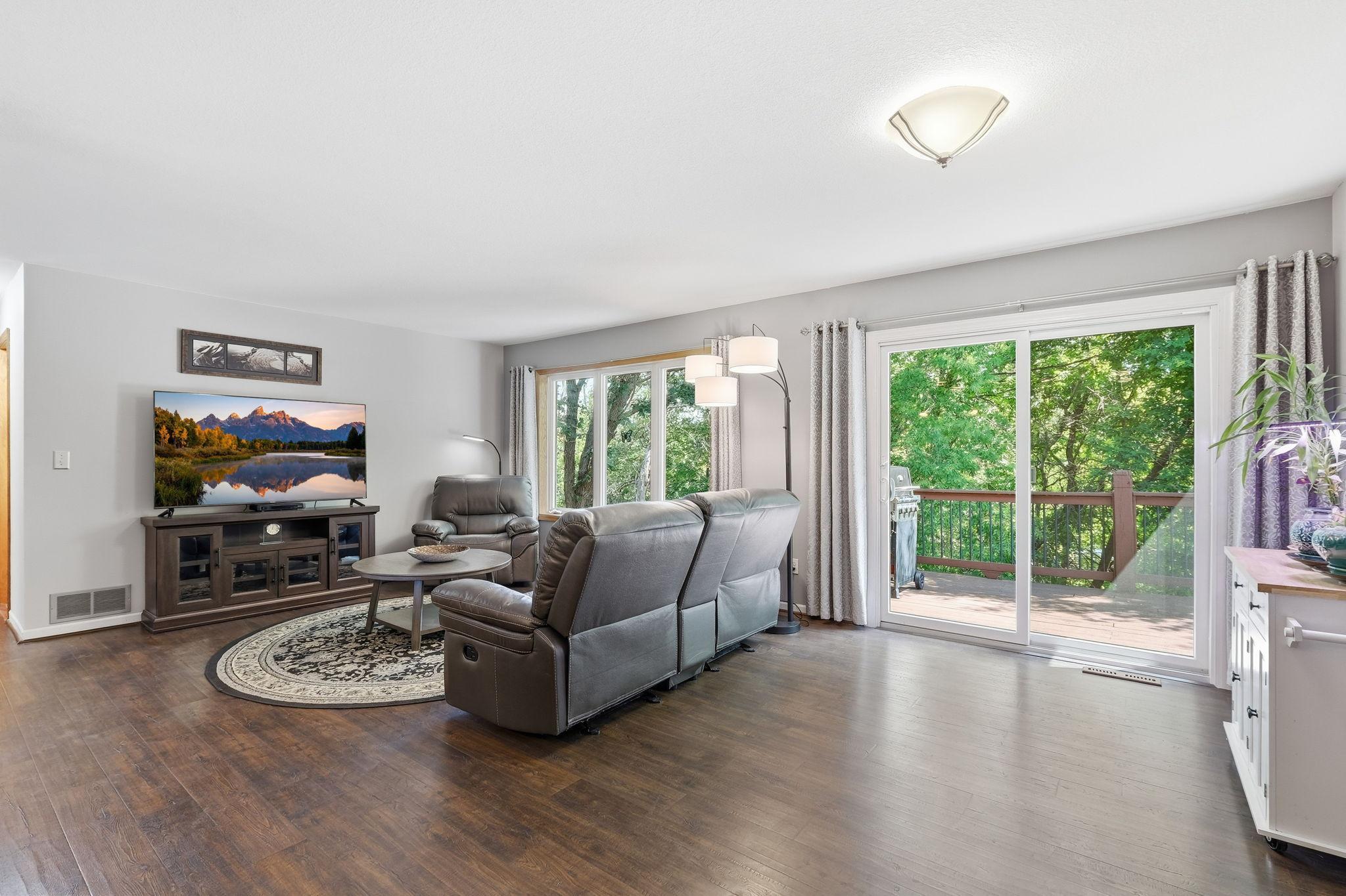 Informal dining area with easy access to the deck, offering a seamless transition to outdoor living overlooking the backyard.
