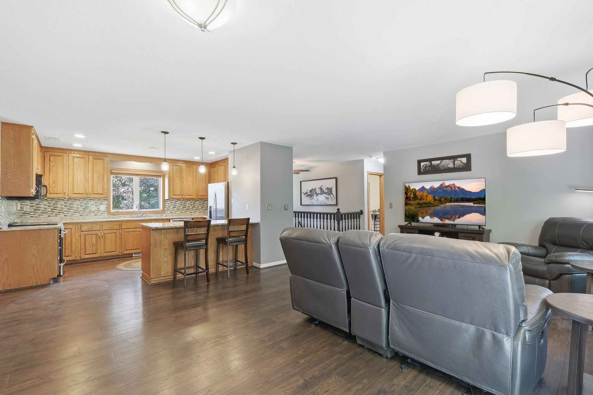 Open-concept layout creates a seamless flow throughout the main level, perfect for everyday living and entertaining.