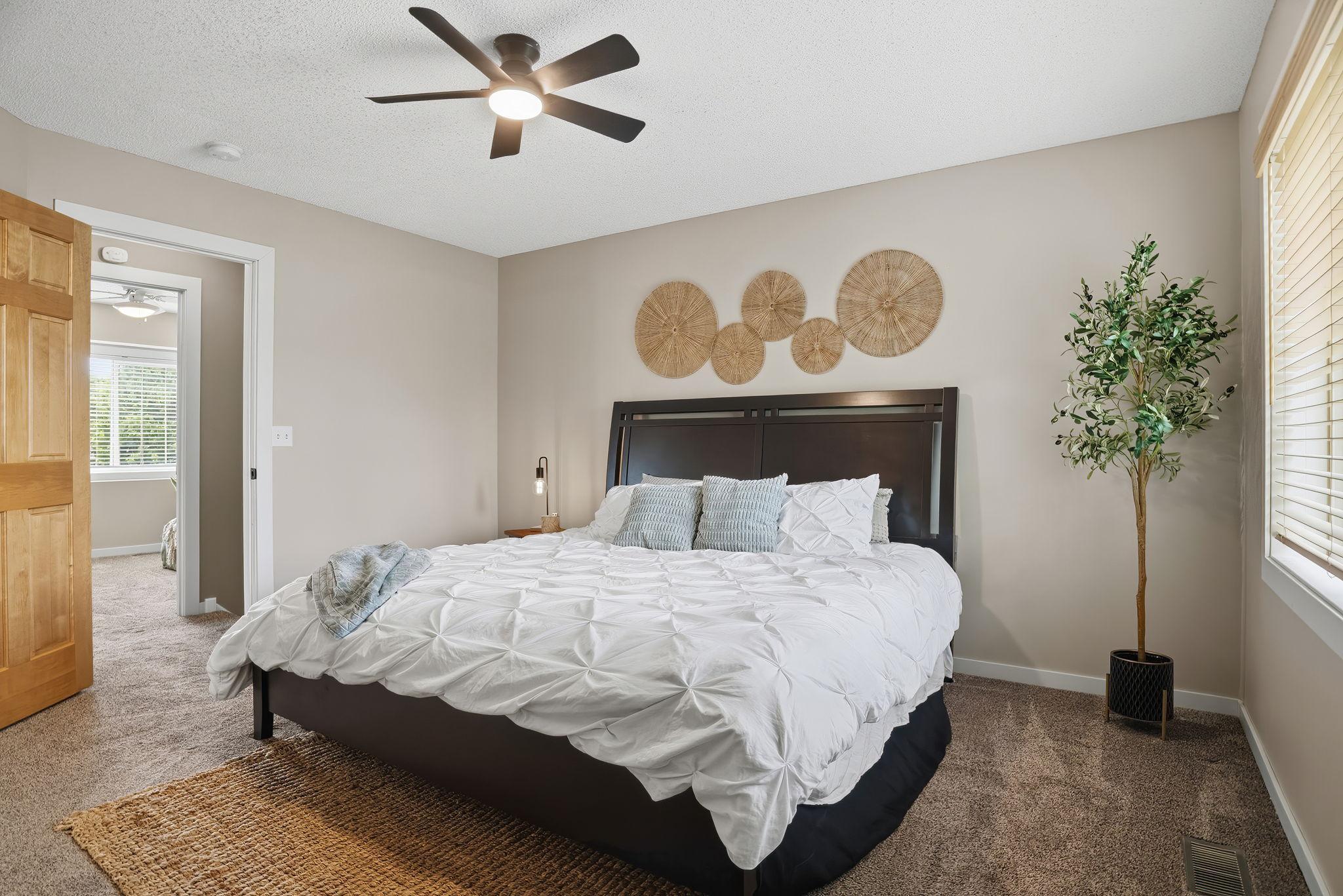 Primary bedroom offers large windows, and walkin closet.