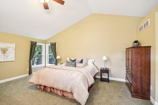 Primary ensuite is massive in size with overhead fans and recessed lighting.