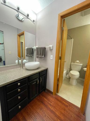 Second sink off the primary bedroom. This area combined with the linen closet next to sink and walk-in closet across could be remodeled for a private 3/4 primary bathroom!