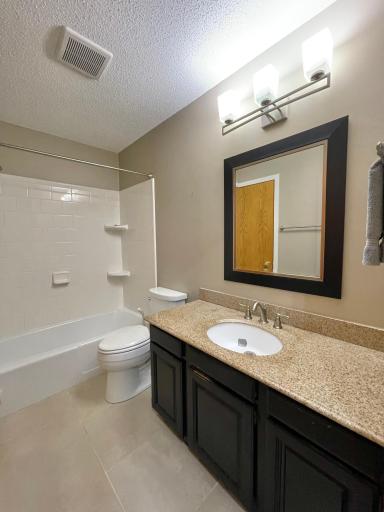 Updated bath with walk thru to primary bedroom.