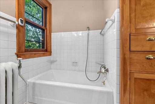 Separate tub/shower, additional shower to the right.