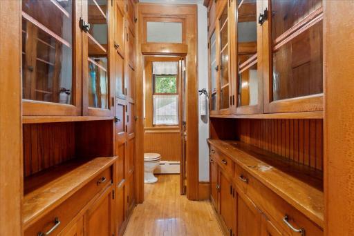 Butler's pantry has been modified with addition of a 1/2 bath.
