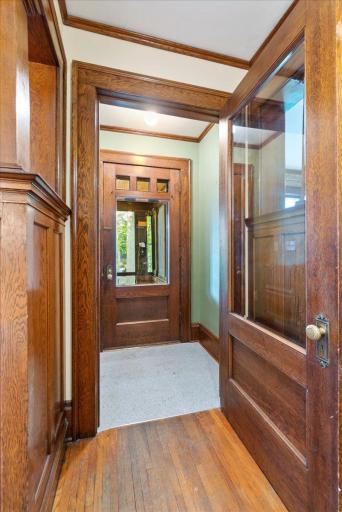 The entry foyer with massive thick oak doors.