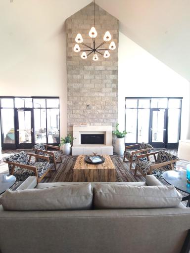 Two story gathering room offers both indoor and outdoor fireplaces..jpg