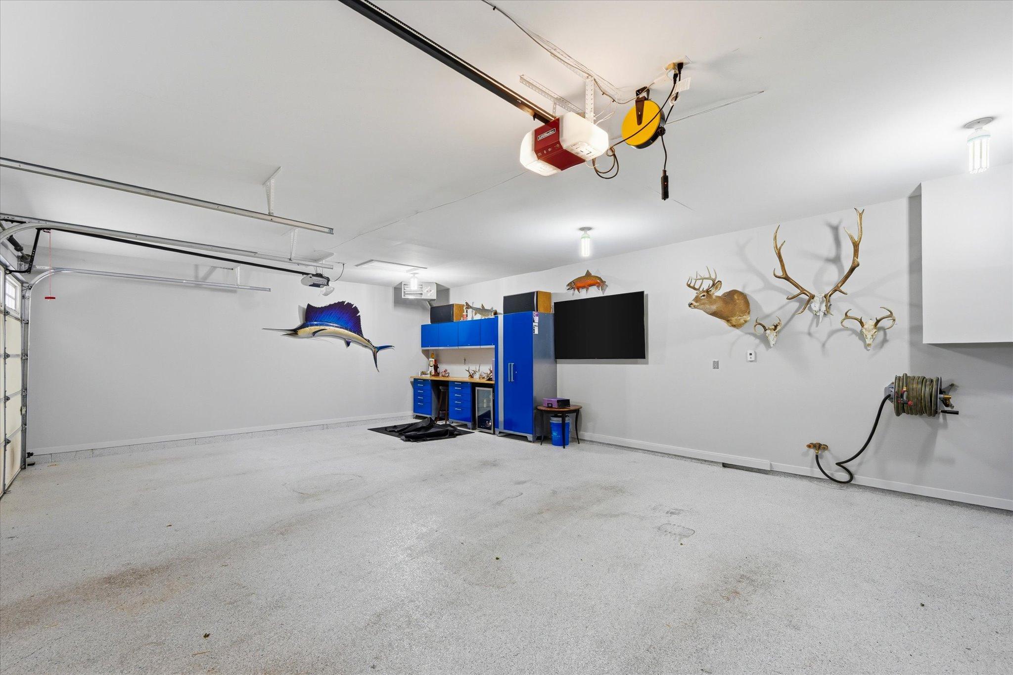 Attached finished and heated garage with epoxy floors.