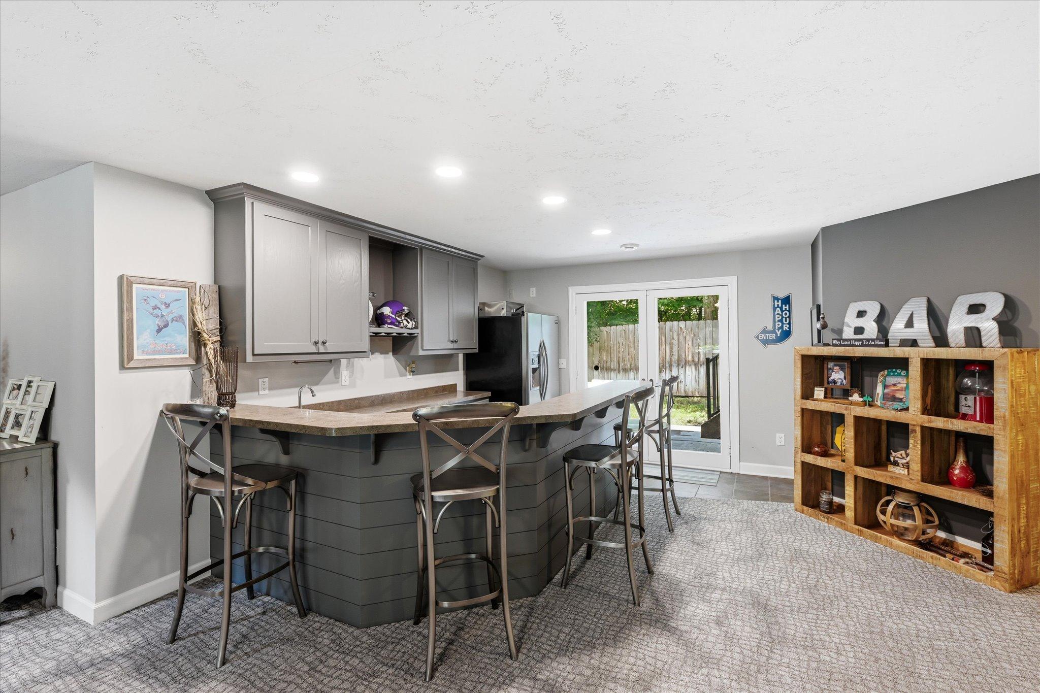 Lower level wetbar with walkout to hot tub and patio