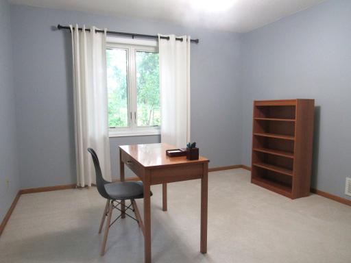 Upper level bedroom with a big double closet, fresh paint and ceiling light.