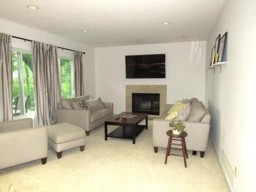 The first floor family room is open from the kitchen and the windows overlook the deck and rear yard. The travertine marble fireplace is the focal point of this cozy room!