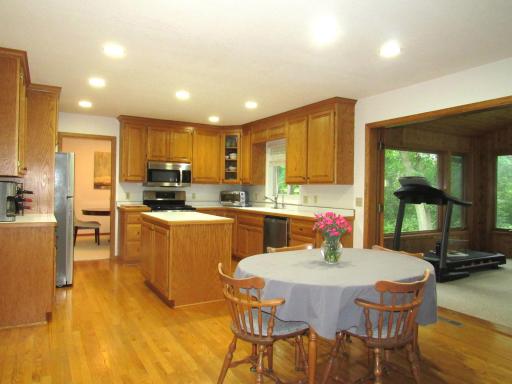 Wonderful big kitchen with a huge area for a table. Great for a informal get together! All open to the 4 season porch and family room.