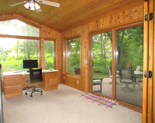The vaulted 4 season porch is wonderful! So much natural light plus a ceiling fan/light. There are patio doors to the deck and rear yard.