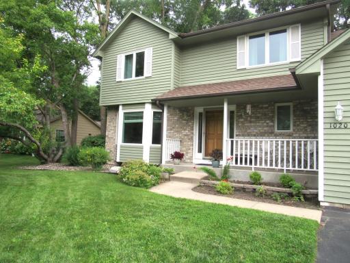 The covered front porch is a great place to chat with neighbors, enjoy the apple blossoms in the spring or just sit and read a great book.