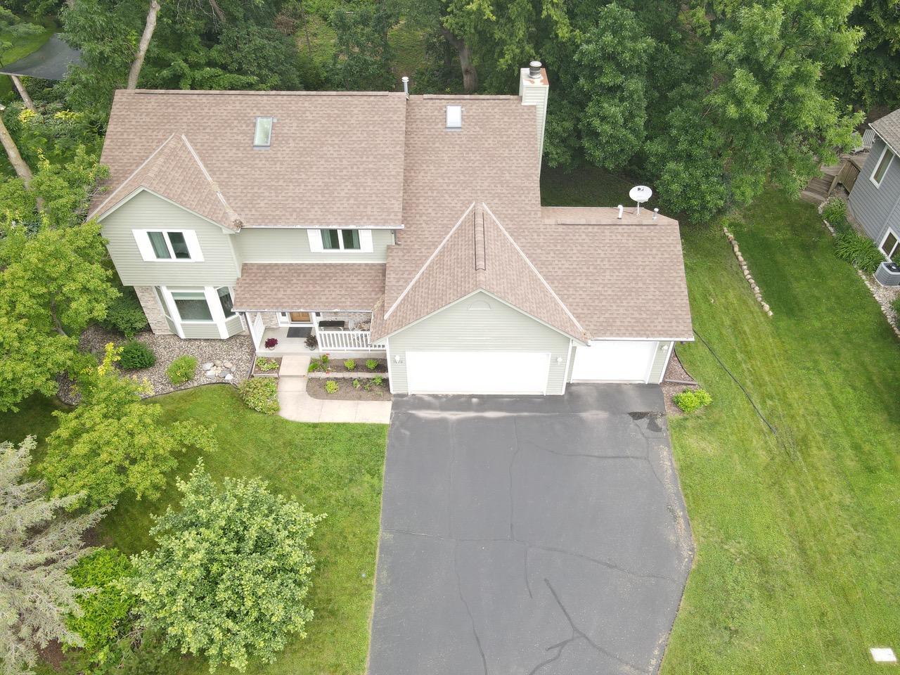 Aerial view of the home. The roof was replaced 6-1/2 years ago. There is a honey crisp apple tree in the front yard. YUM!