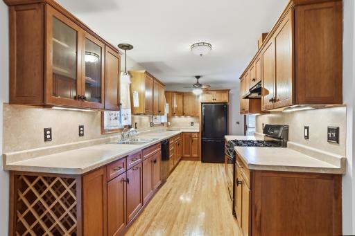 The beautiful kitchen features new flooring and an abundance of cabinet space, making it both attractive and functional for everyday living.