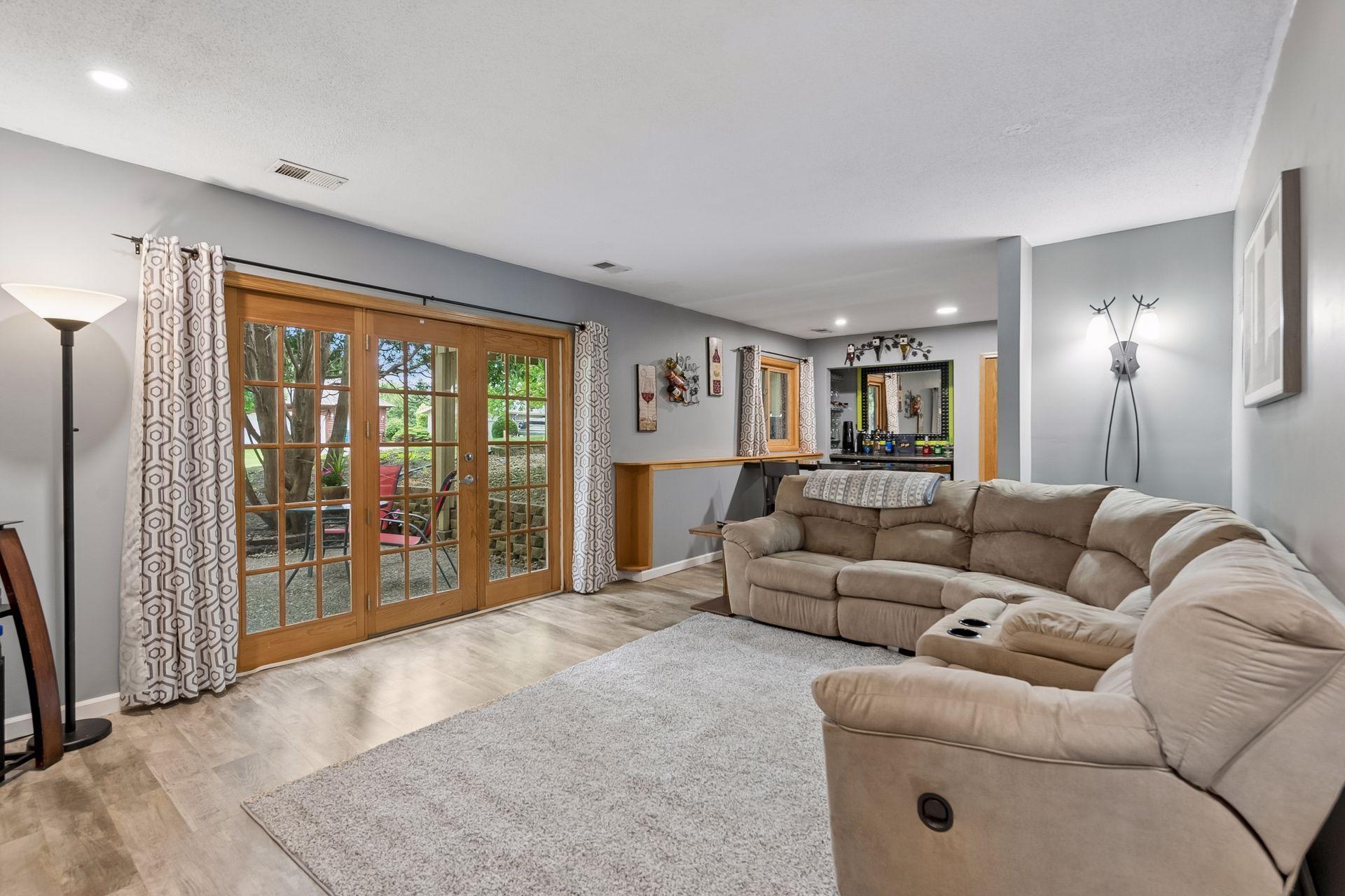 Perfect entertaining space with Walkout Doors to exterior Patio and a Dry Bar