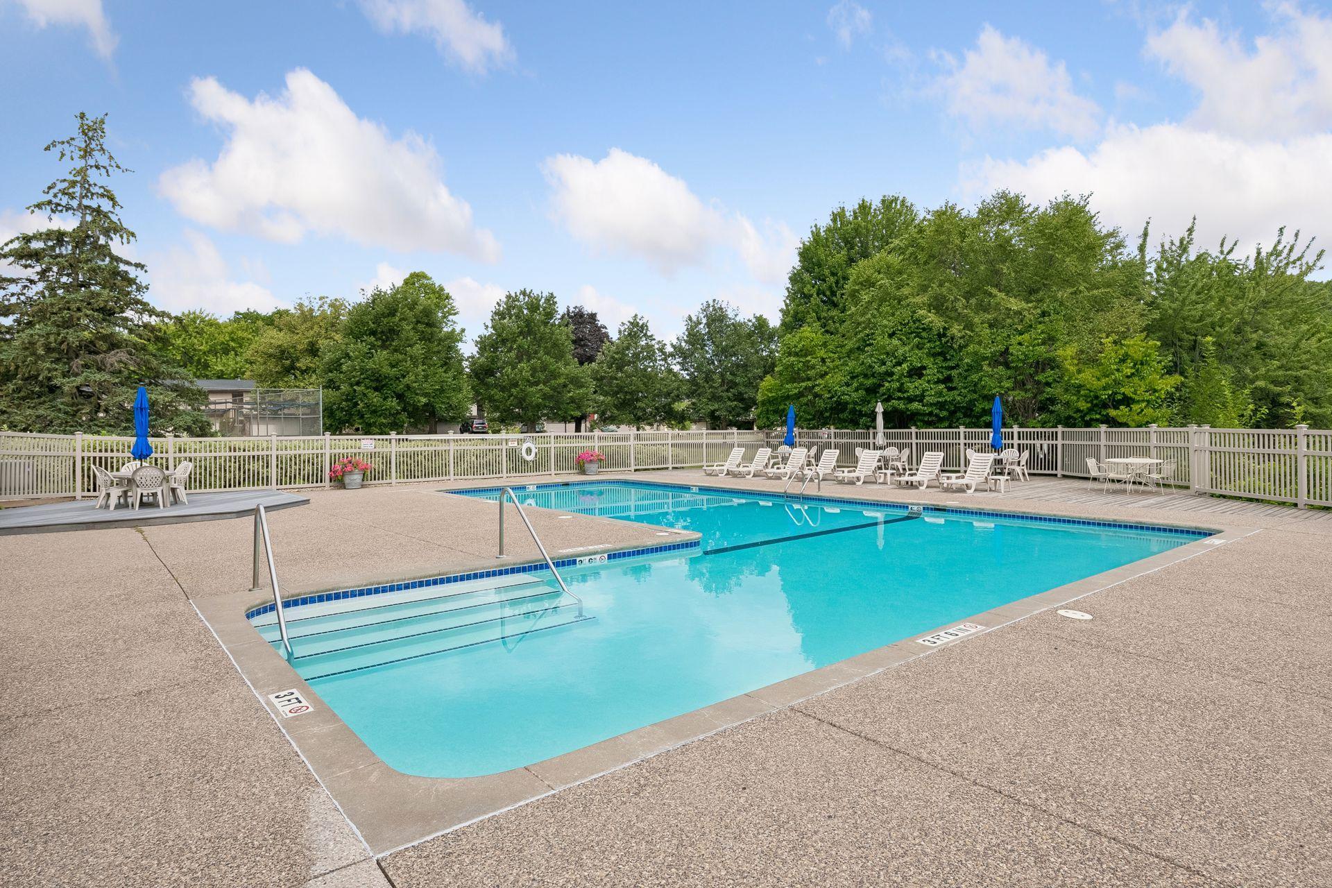 Beautifully maintained Pool with Pool Chairs and Lounge area at back