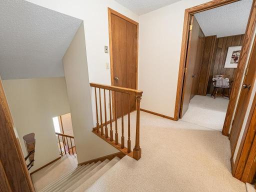 2nd story upper landing. Behind the closed door easy access to 11ftx13ft unfinished area with plywood floor used for storage.
